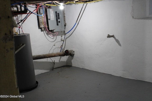 basement with electric panel and water heater