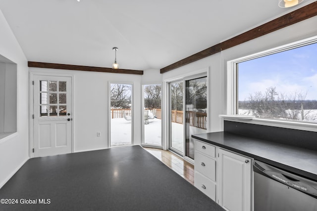 kitchen with white cabinetry, beam ceiling, stainless steel dishwasher, and light hardwood / wood-style floors