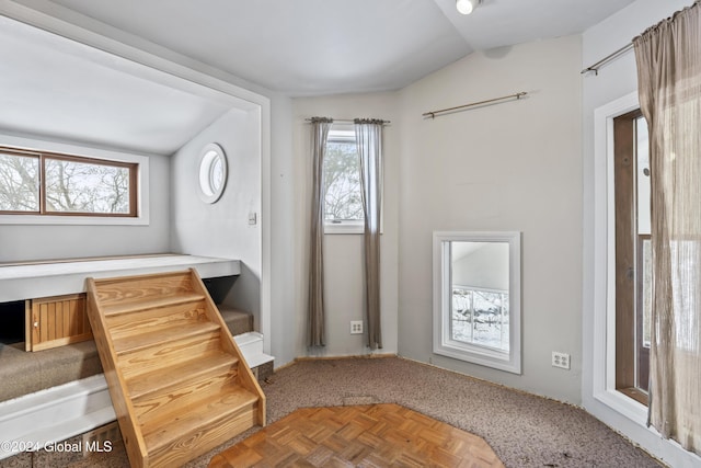 entryway with vaulted ceiling and parquet floors