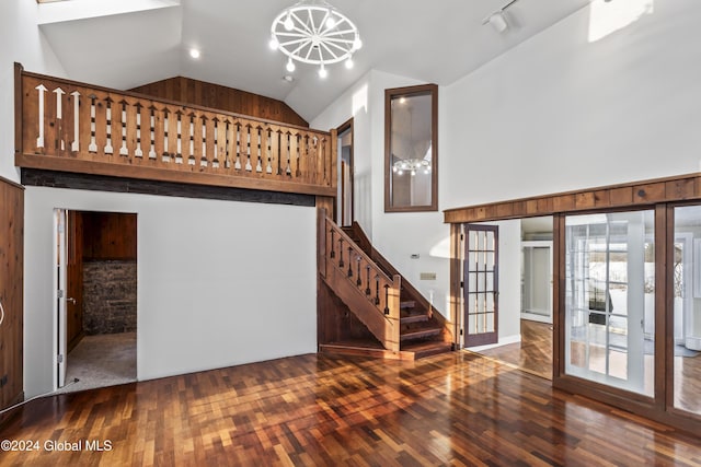 interior space featuring high vaulted ceiling and dark hardwood / wood-style floors