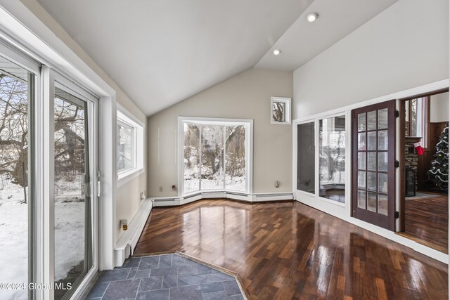 interior space featuring lofted ceiling and dark hardwood / wood-style floors