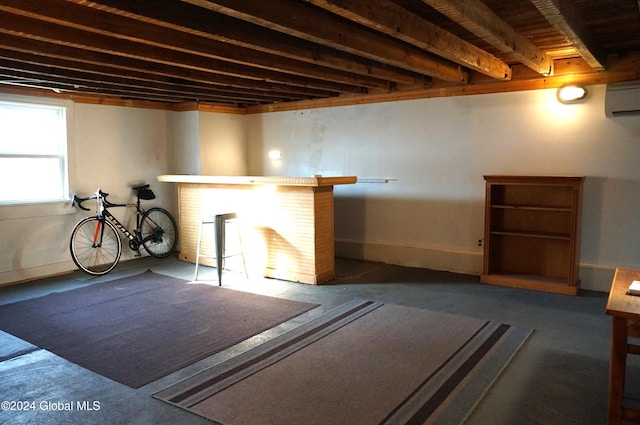 basement featuring an AC wall unit