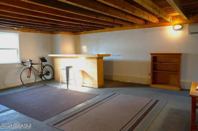 basement featuring a wall mounted AC