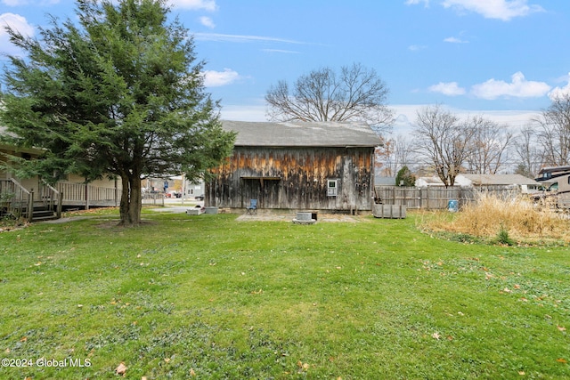 view of yard with a wooden deck