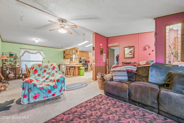 living room featuring ceiling fan, light colored carpet, and a textured ceiling