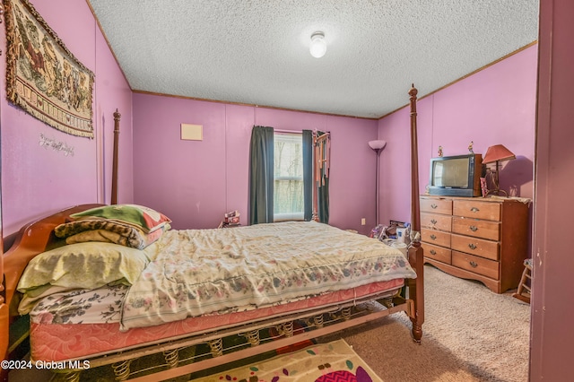 carpeted bedroom featuring a textured ceiling