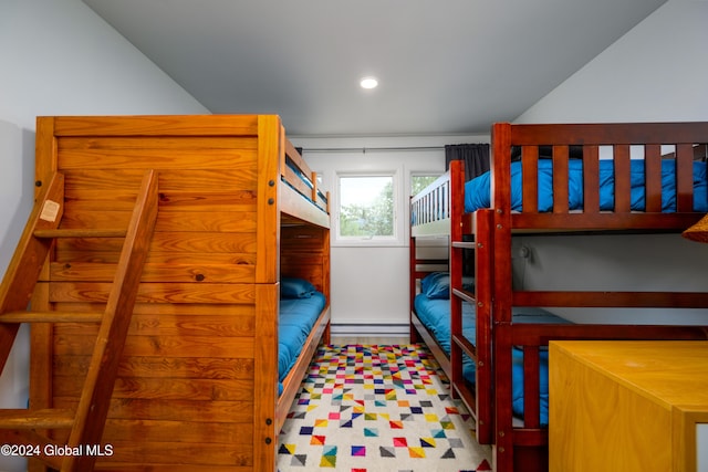 bedroom with a baseboard heating unit