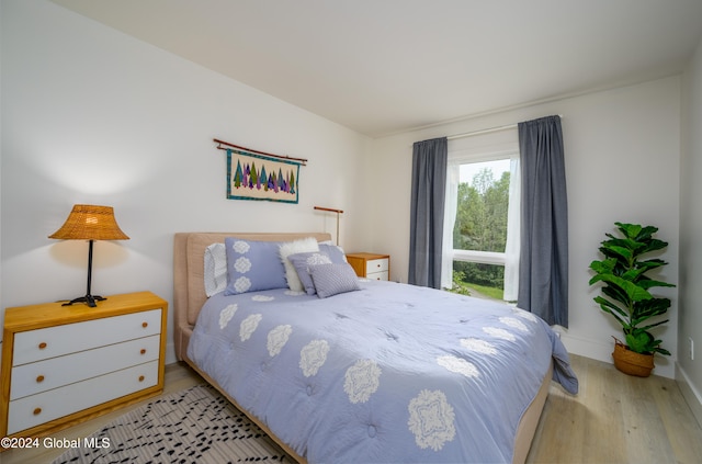 bedroom with light wood-type flooring