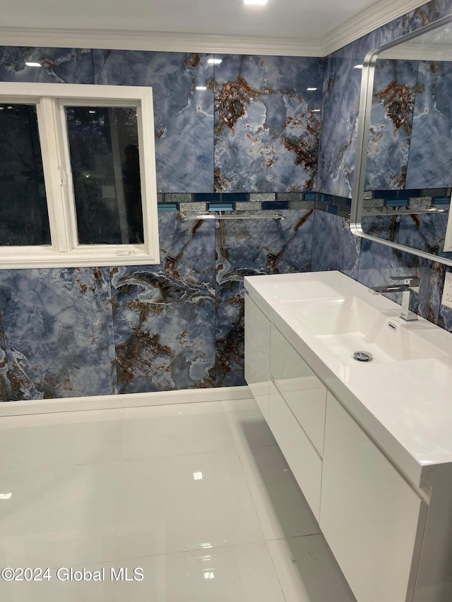 bathroom featuring vanity, tile walls, and ornamental molding