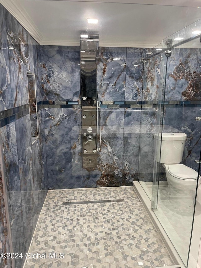 bathroom featuring an enclosed shower, toilet, tile walls, and crown molding