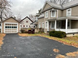 exterior space featuring an outbuilding and a garage