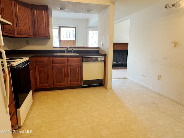 kitchen with white appliances and sink