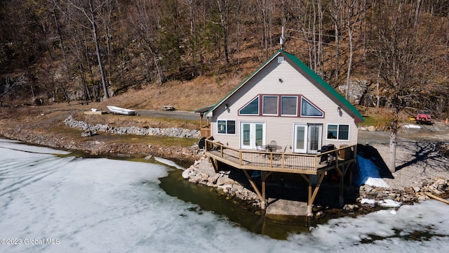 rear view of house featuring french doors and a deck