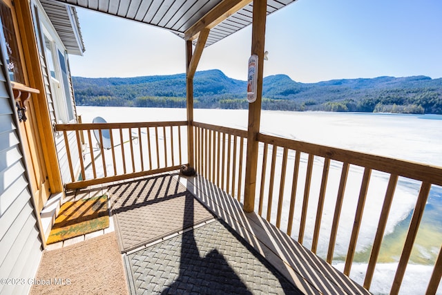 balcony with a water and mountain view