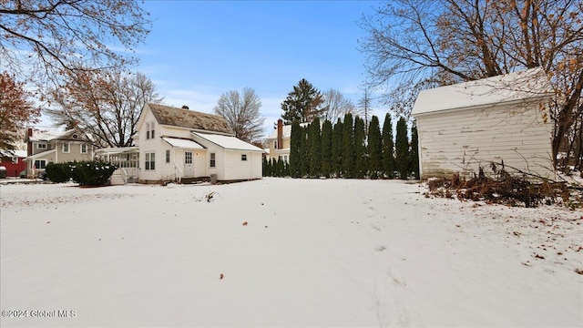 view of yard layered in snow