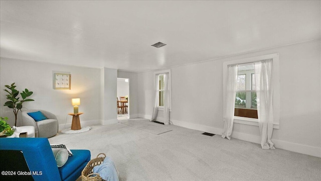 living area with light colored carpet