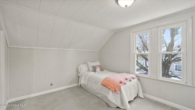 carpeted bedroom with vaulted ceiling