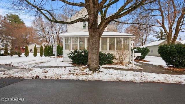 view of front of property featuring a sunroom