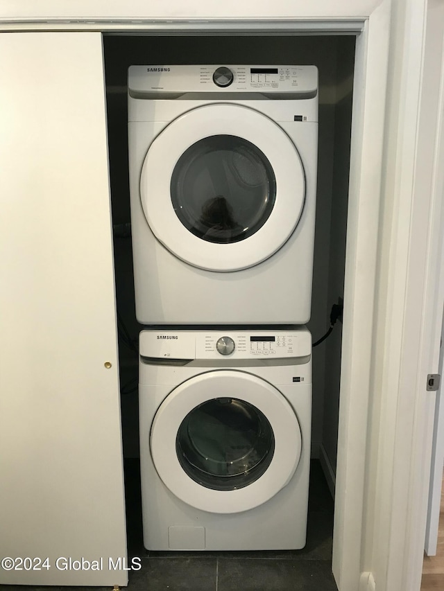 laundry area with stacked washer / dryer