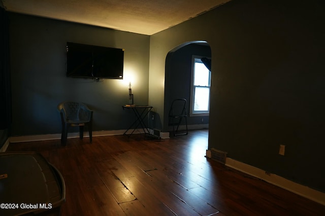 unfurnished room featuring dark hardwood / wood-style flooring