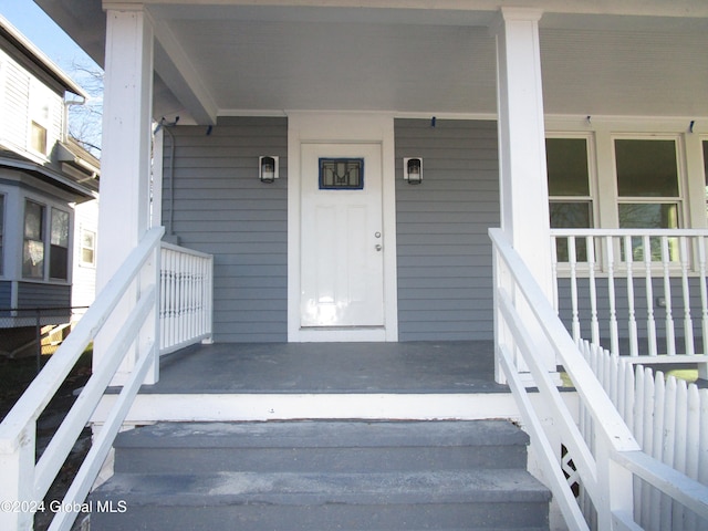 entrance to property with a porch