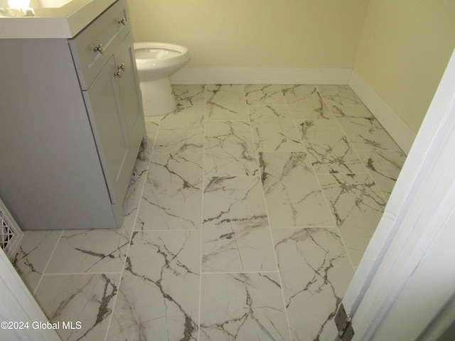 bathroom with vanity and toilet