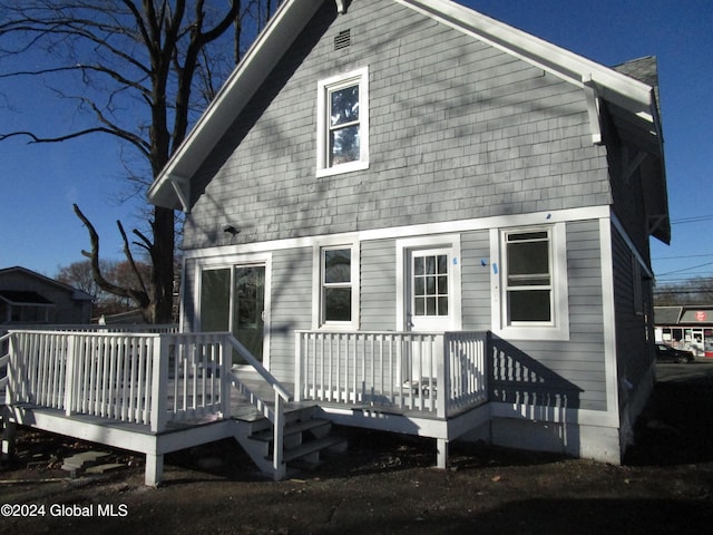 back of house with a wooden deck