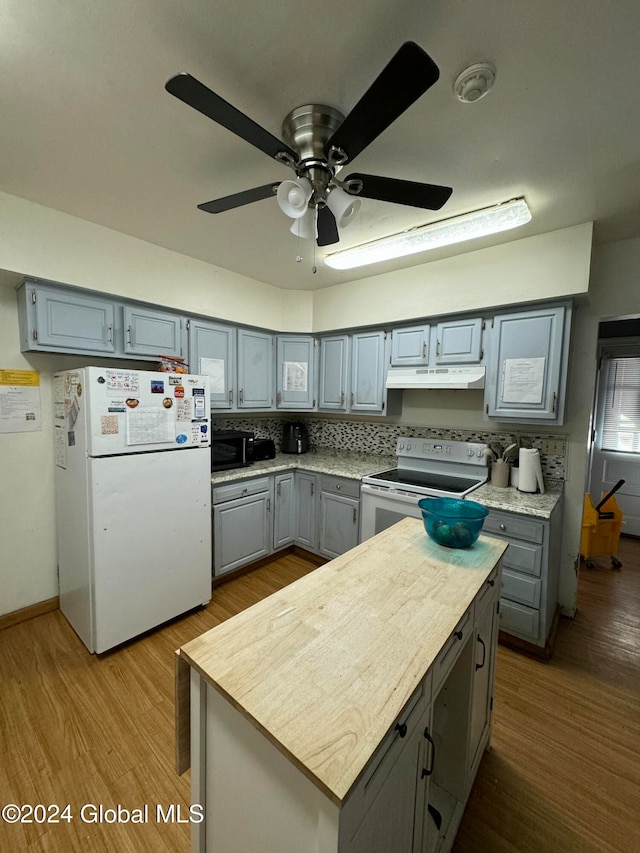 kitchen featuring decorative backsplash, white appliances, ceiling fan, light hardwood / wood-style flooring, and gray cabinets