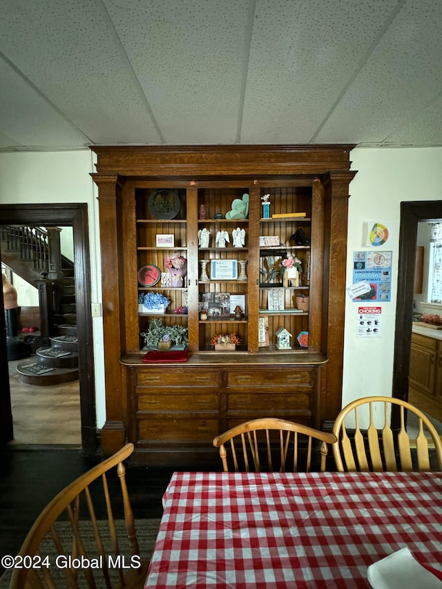 dining space featuring a drop ceiling