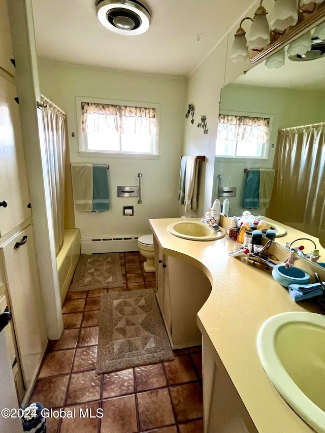 full bathroom with a wealth of natural light, vanity, a baseboard radiator, and toilet