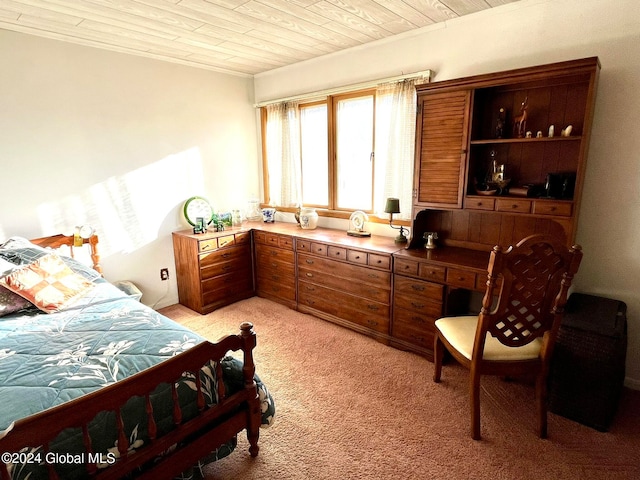 bedroom with light colored carpet and wooden ceiling