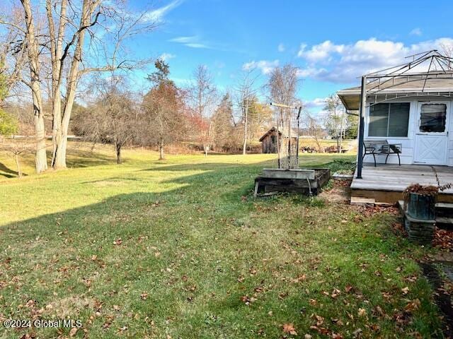 view of yard with a deck