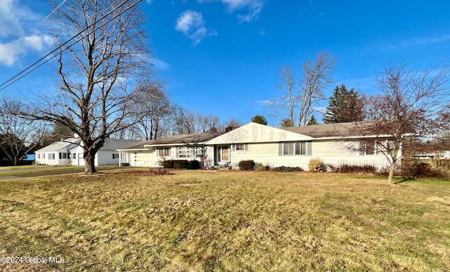 ranch-style house with a front lawn