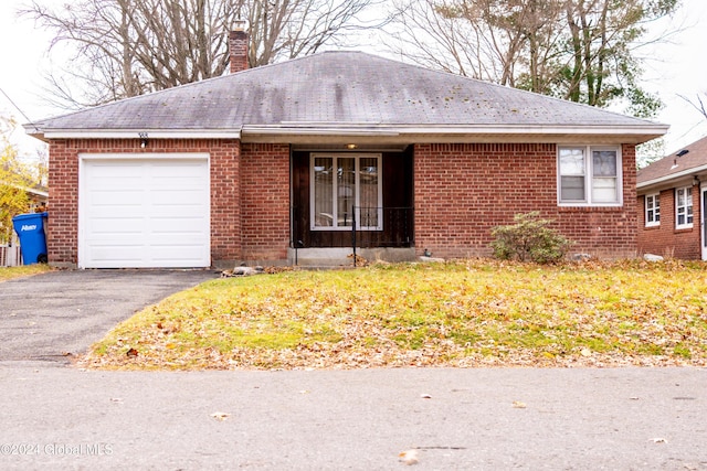 ranch-style house featuring a garage