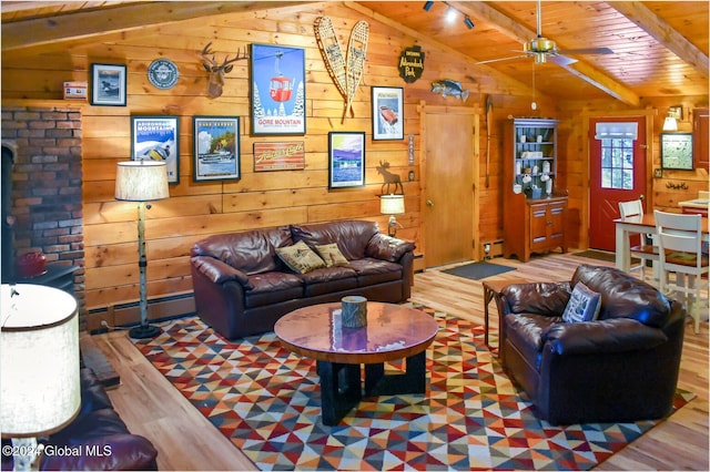 living room with wooden ceiling, vaulted ceiling with beams, a baseboard heating unit, wood walls, and hardwood / wood-style floors