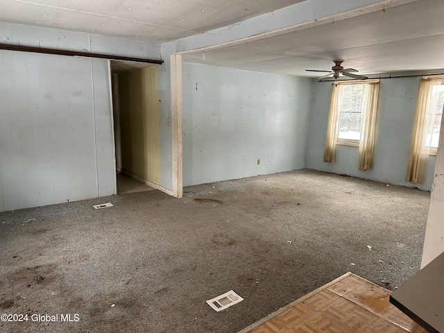 unfurnished room featuring ceiling fan