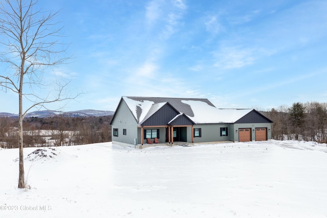 modern inspired farmhouse with a garage