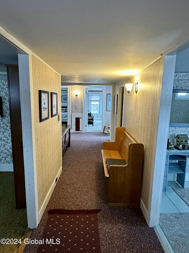 hallway with dark carpet