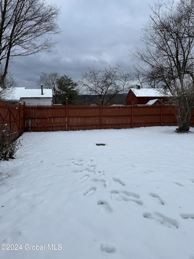 view of yard covered in snow