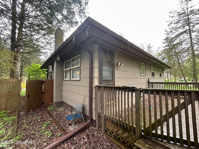 view of side of home featuring a deck