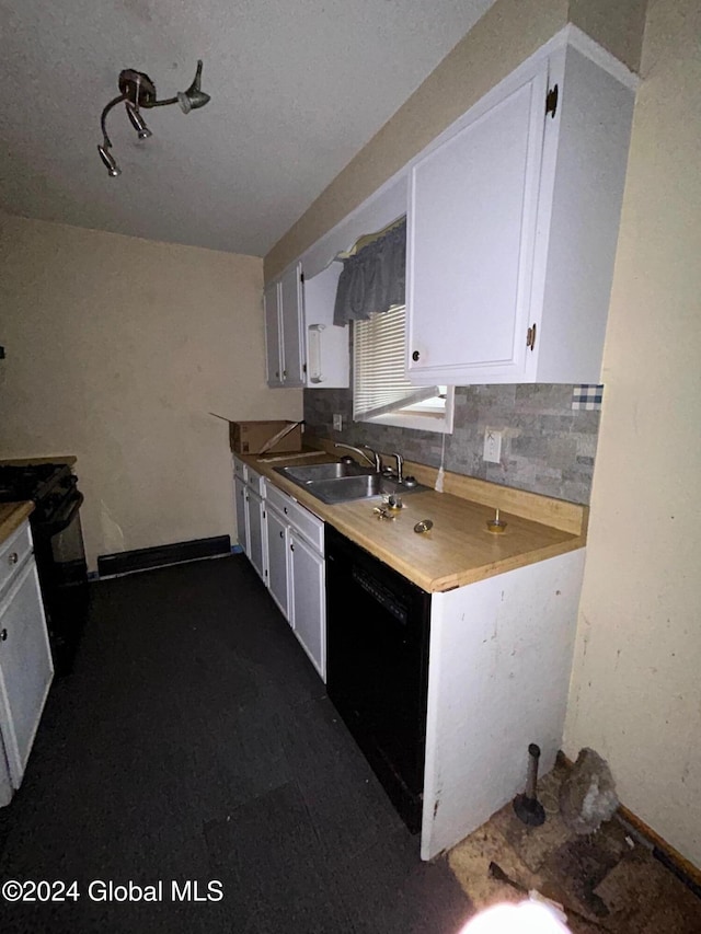 kitchen with decorative backsplash, white cabinets, black appliances, and sink