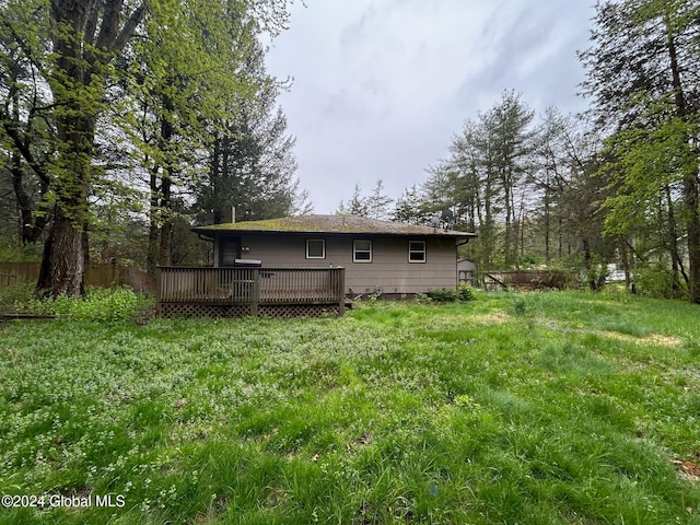 back of property featuring a wooden deck