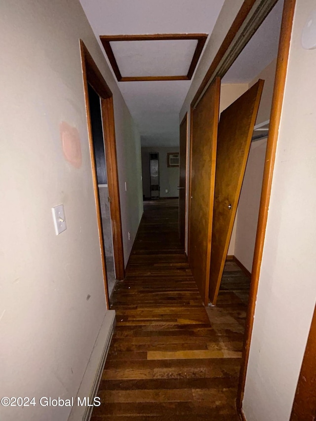 hallway with dark hardwood / wood-style floors