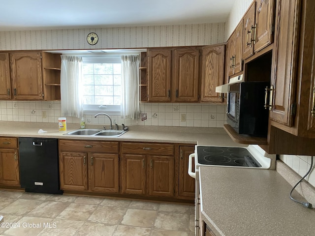 kitchen featuring electric range, dishwasher, backsplash, and sink