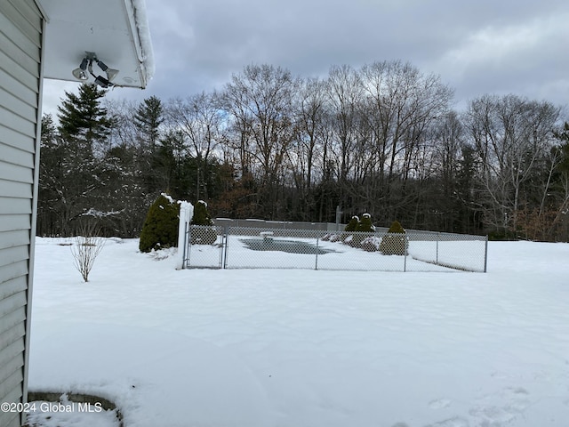 view of yard covered in snow