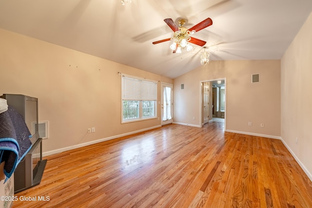 unfurnished living room with ceiling fan, light wood-type flooring, and vaulted ceiling