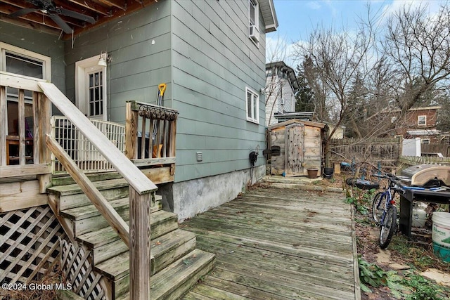 wooden deck featuring a shed