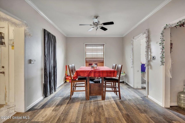 dining room with ceiling fan, dark hardwood / wood-style flooring, and ornamental molding