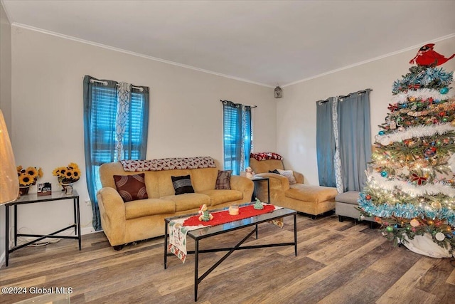 living room featuring hardwood / wood-style floors, a healthy amount of sunlight, and ornamental molding