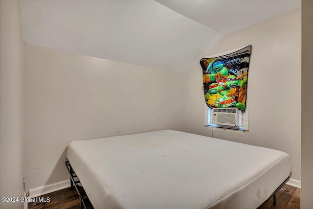 bedroom featuring dark hardwood / wood-style flooring, cooling unit, and lofted ceiling